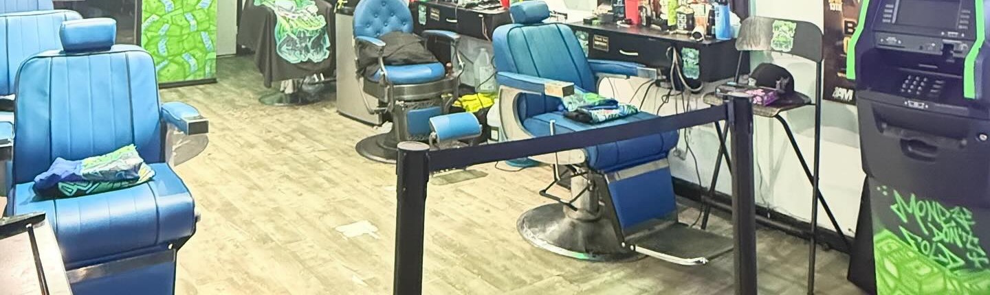 Barber stations inside New Money Cuts Barbershop, East New York